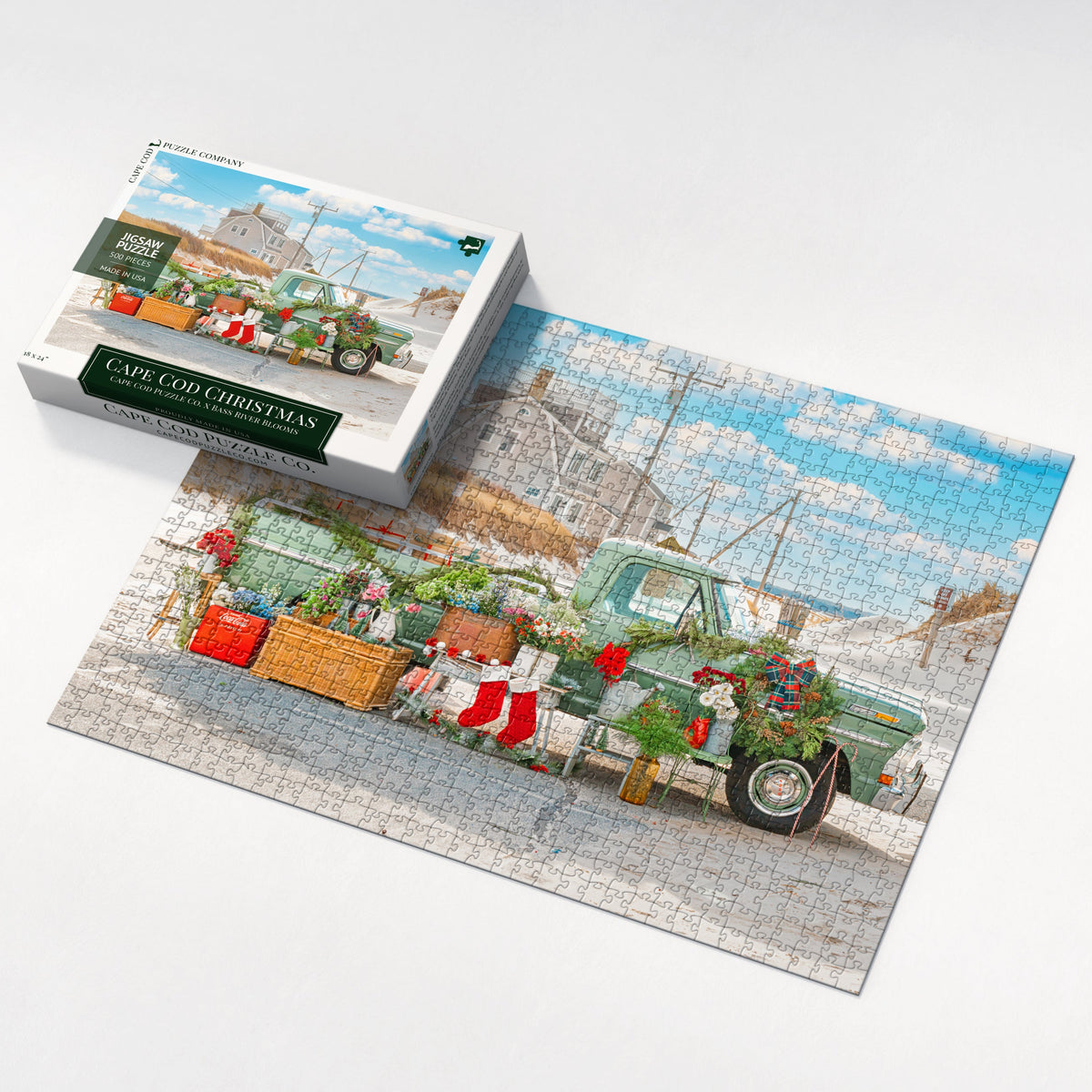 Jigsaw puzzle with a completed scene and packaging on a white background
